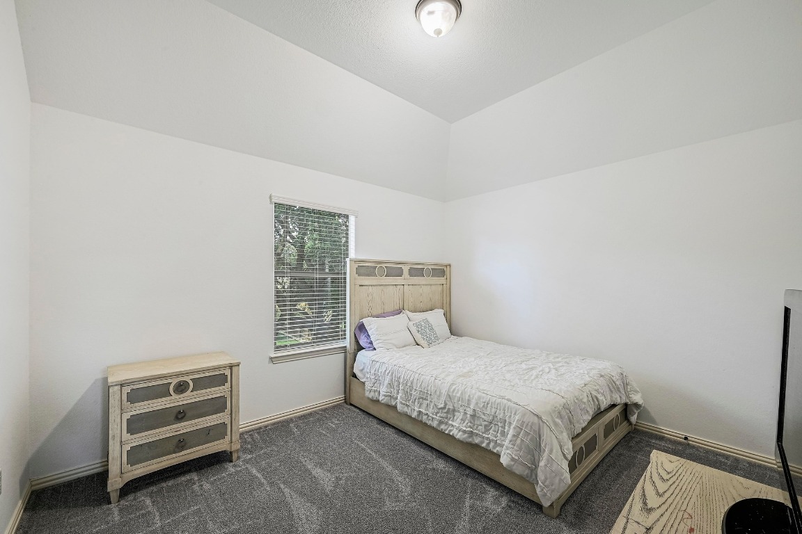 2229 Turtle Mountain Bend Austin, TX 78748 - Photo 27 of 38 a bedroom with a bed and a dresser