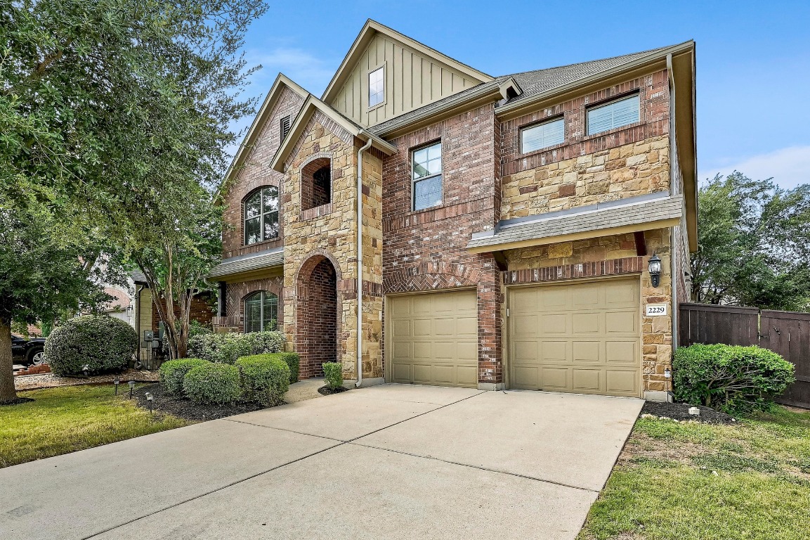 2229 Turtle Mountain Bend Austin, TX 78748 - Photo 5 of 38 a front view of a house with a garden and plants