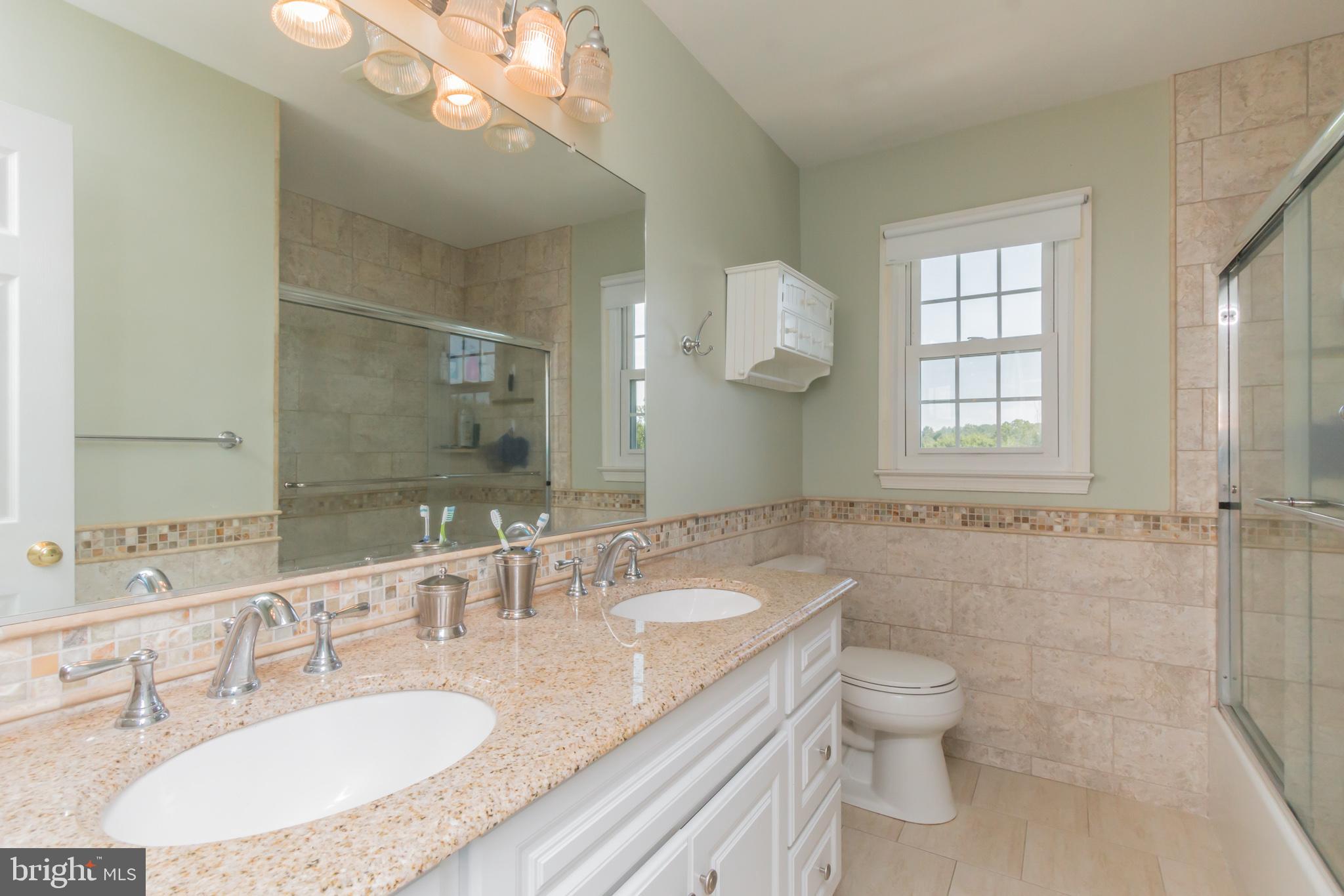 9217 Huntmaster Road Gaithersburg, MD 20882 - Photo 20 of 34 Renovated hall bath