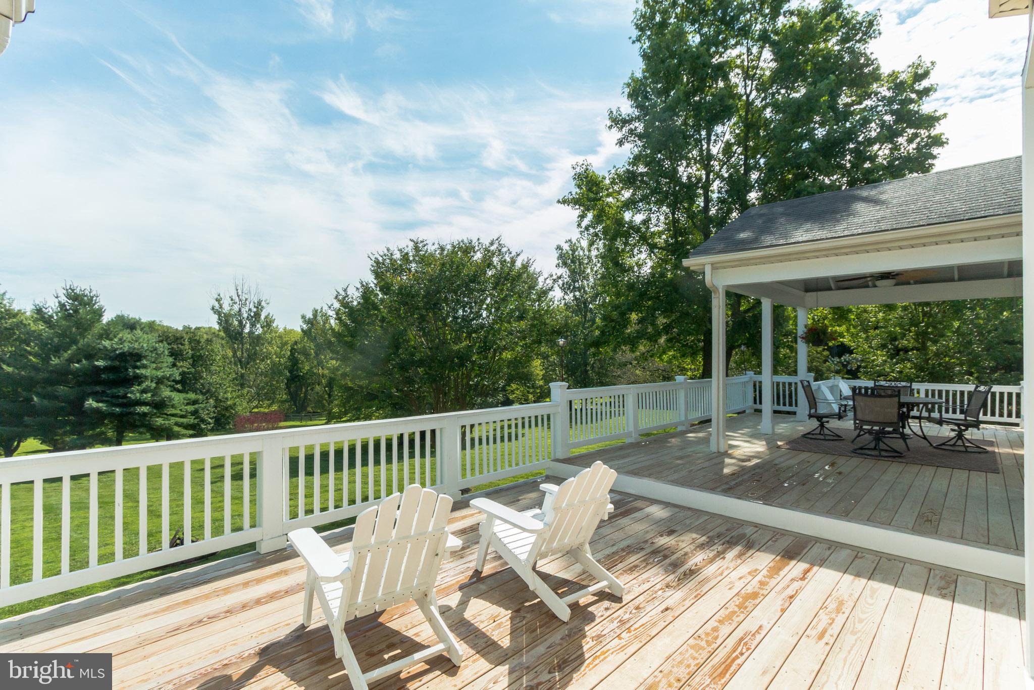 9217 Huntmaster Road Gaithersburg, MD 20882 - Photo 25 of 34 Extended and renovated deck with portico