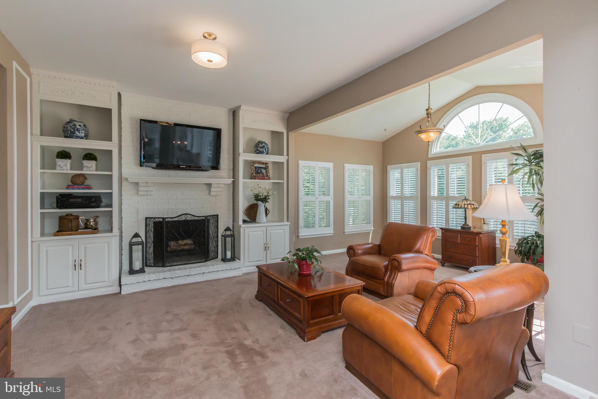 9217 Huntmaster Road Gaithersburg, MD 20882 - Photo 7 of 34 Family room with brick fireplace