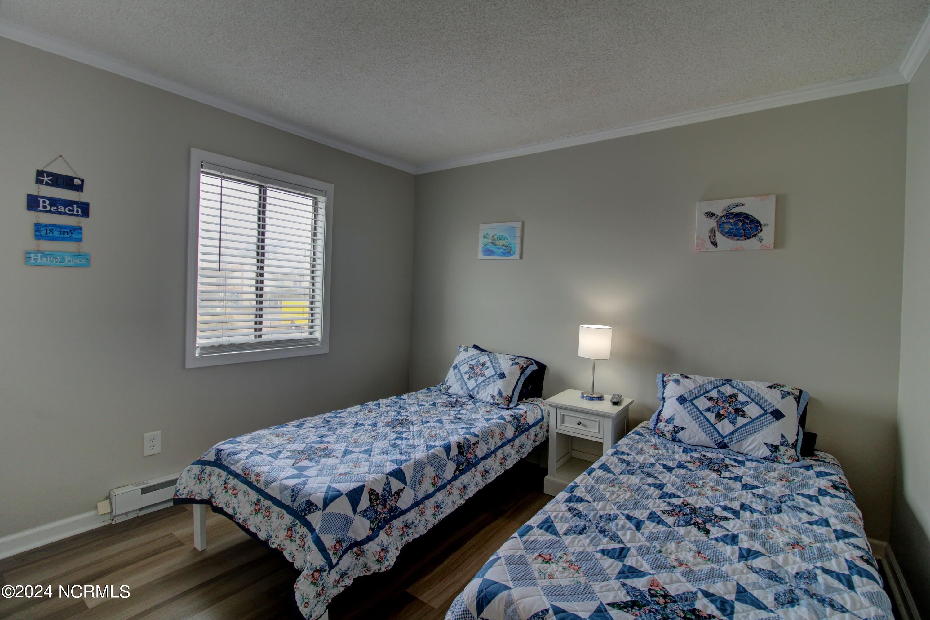 2240 New River Inlet Road, Unit 130 North Topsail Beach, NC 28460 - Photo 9 of 25 Twin Bedroom
