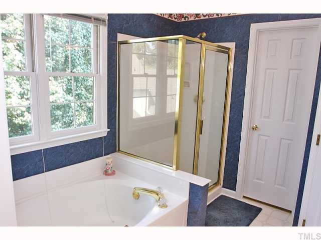 112 Fetzer Court Cary, NC 27513 - Photo 10 of 12 a bathroom with a sink and a mirror