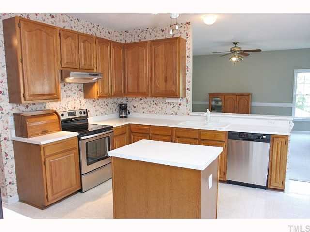 112 Fetzer Court Cary, NC 27513 - Photo 6 of 12 a kitchen that has a sink and a stove