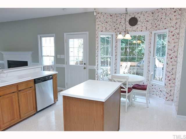 112 Fetzer Court Cary, NC 27513 - Photo 7 of 12 a kitchen with a sink stove and cabinets
