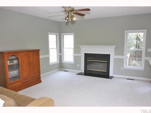 112 Fetzer Court Cary, NC 27513 - Photo 12 of 12 a view of an empty room with window and fire place