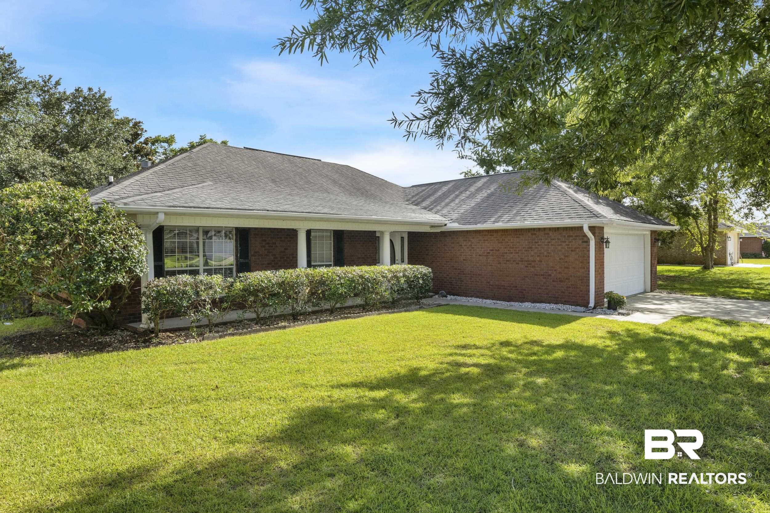 9610 Watkins Drive Fairhope, AL 36532 - Photo 16 of 26 Ranch-style house featuring a garage and a front lawn