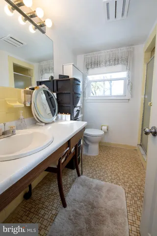 a dining room with a table and chairs