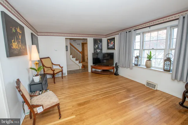 a room with furniture and a wooden floor