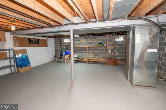 a view of water heater room with a tv
