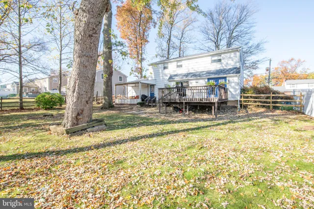 a backyard of a house with yard and outdoor seating
