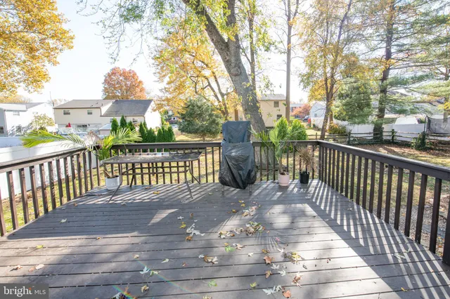 a view of a wooden fence and a bench