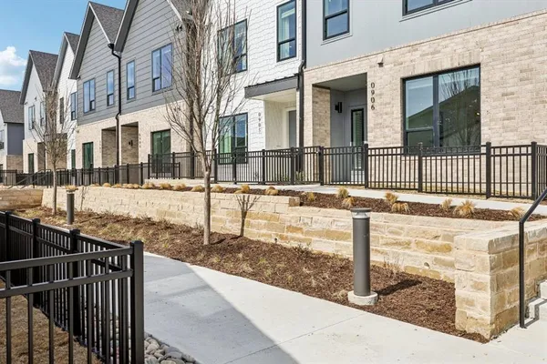 a view of a brick building with many windows