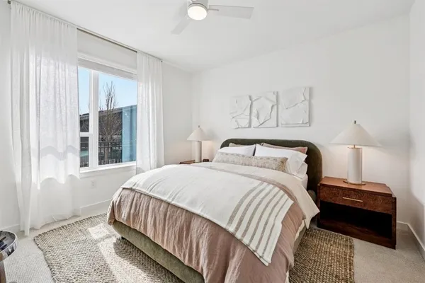 a bedroom with a bed and a couch