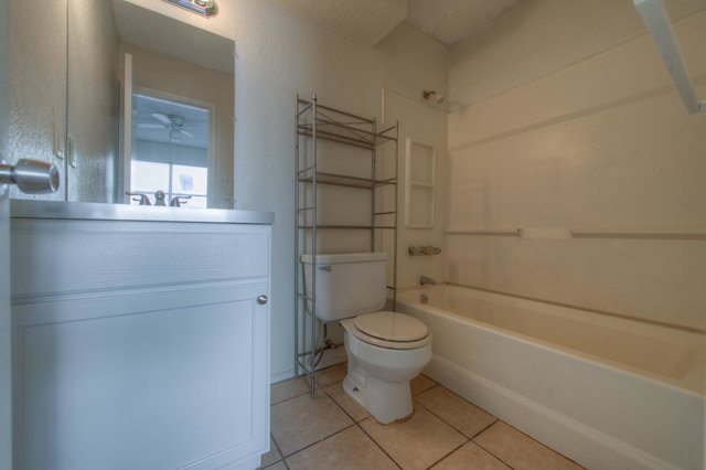 6906 Deep Circle, Unit B Austin, TX 78744 - Photo 16 of 19 Full bath with vanity, tub / shower combination, and light tile patterned floors