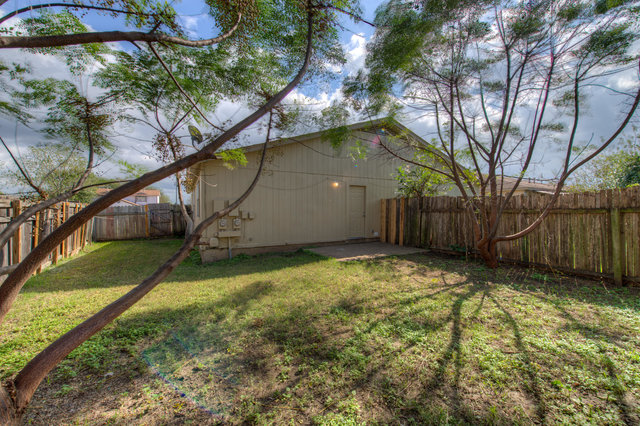 6906 Deep Circle, Unit B Austin, TX 78744 - Photo 3 of 19 Fenced backyard featuring a patio area