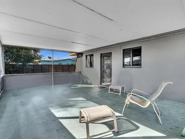 a view of a chairs and table in a room