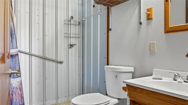 a bathroom with a sink and toilet