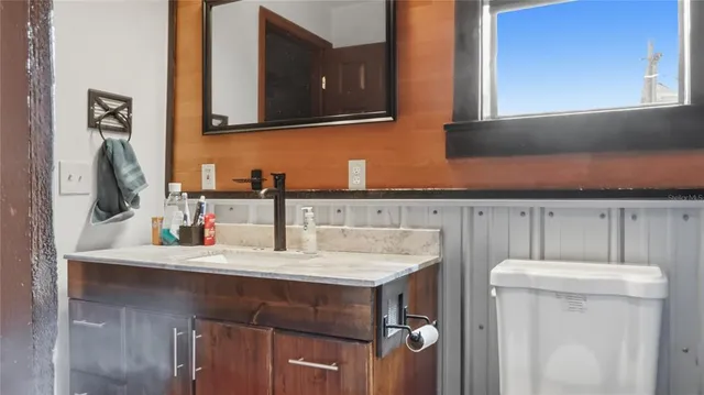 a bathroom with a sink and a mirror