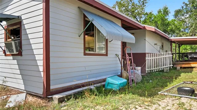 a backyard of a house with seating space
