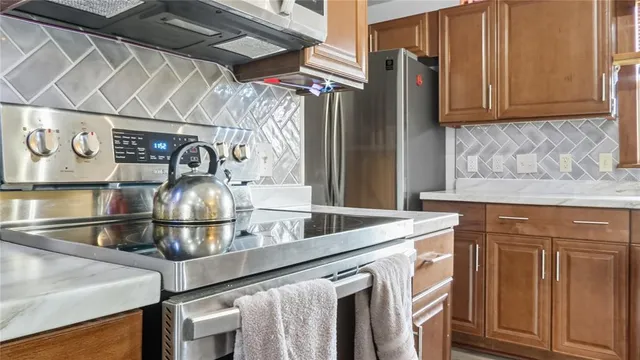 a kitchen with a sink and a refrigerator