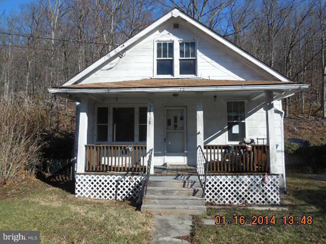 14318 Winchester Road Southwest Lavale, MD 21502 - Photo 1 of 1 a front view of a house with a garden