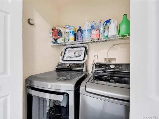 a view of livingroom with refrigerator and stove