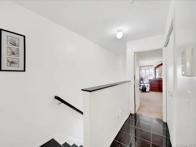 a view of a hallway view with staircase