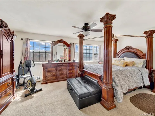 a bedroom with furniture and a window