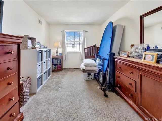 a room with furniture and a dresser