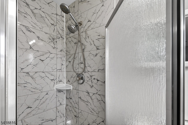 569 Scotland Road Union, NJ 07083 - Photo 17 of 23 a bathroom with a shower curtain