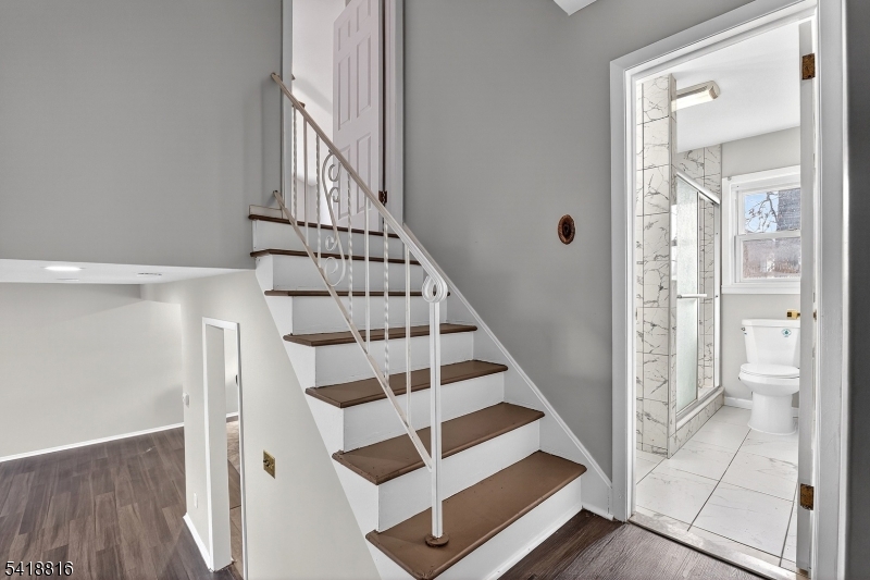 569 Scotland Road Union, NJ 07083 - Photo 18 of 23 a view of entryway with wooden floor and staircase