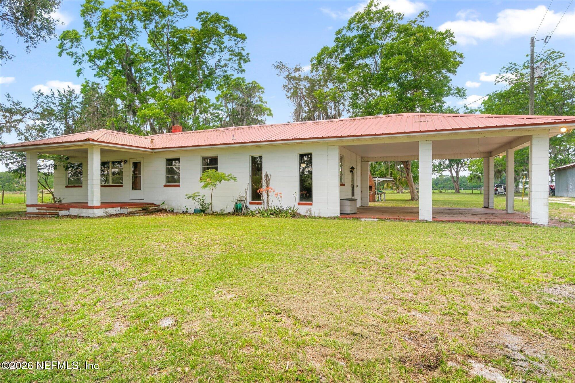 786 West River Road Palatka, FL 32177 - Photo 28 of 53 a front view of house with yard having outdoor seating