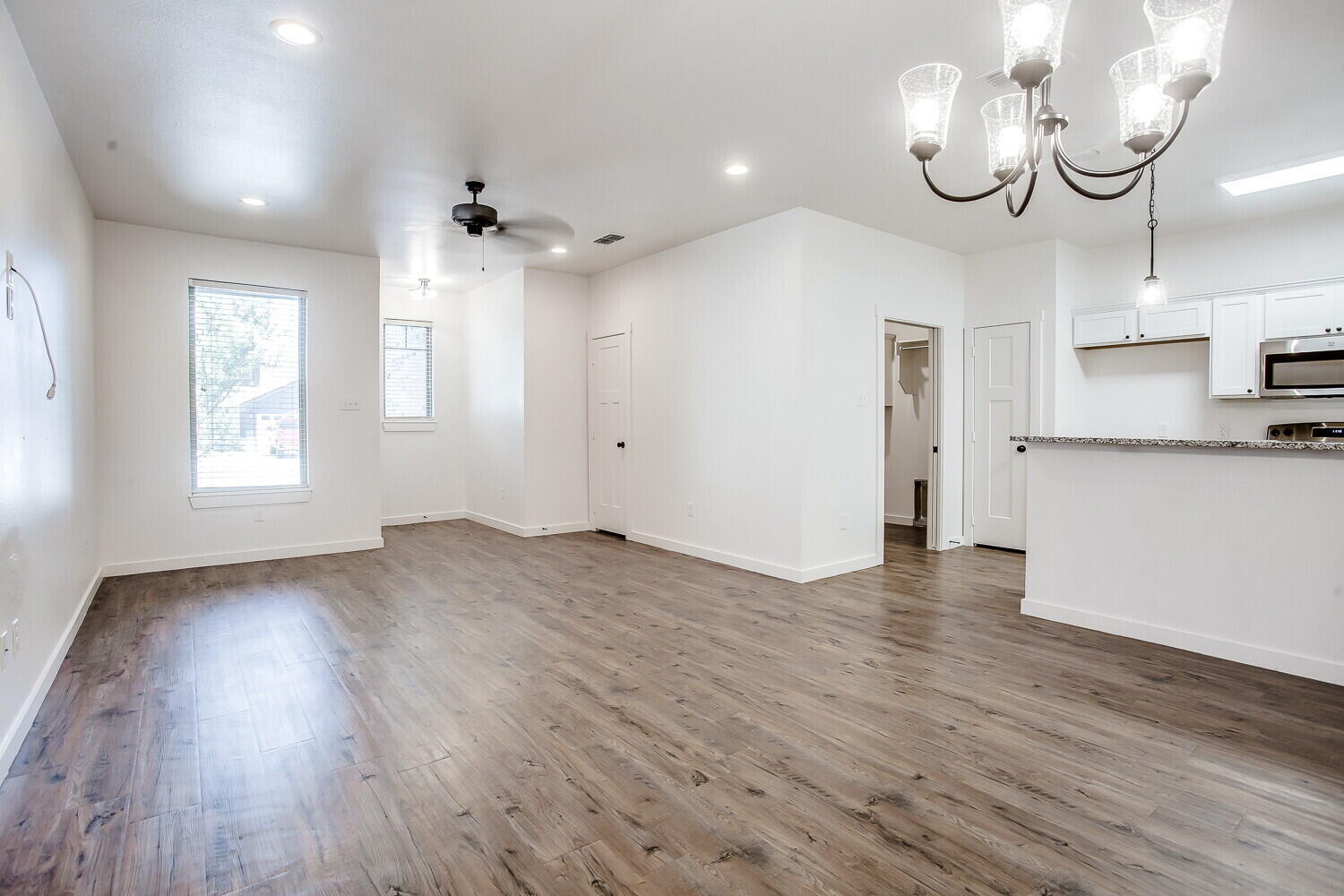 2535 138th Street Lubbock, TX 79423 - Photo 5 of 15 a view of a kitchen with wooden floor and a sink