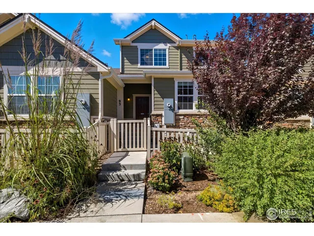 a view of a patio with a table and chairs