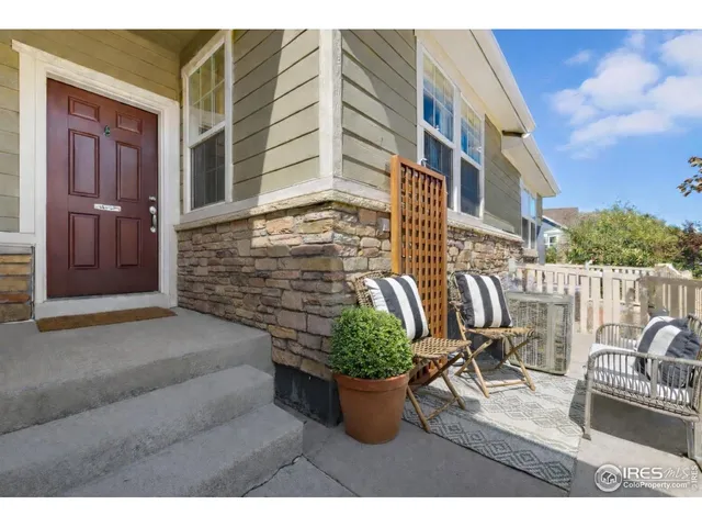 a living room with stainless steel appliances kitchen island granite countertop furniture and a dining table