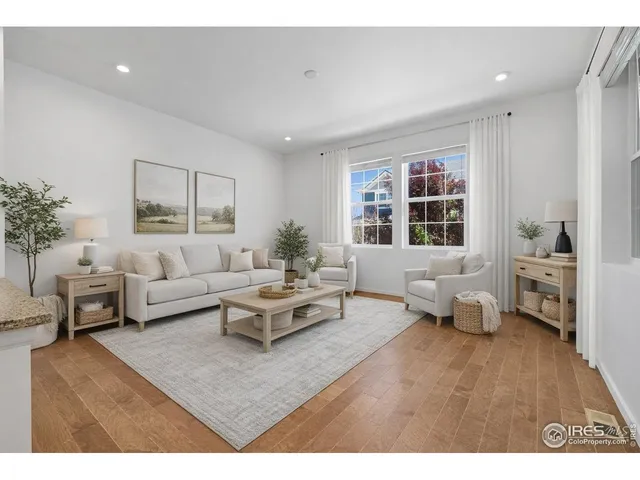 a dining room with furniture and potted plant