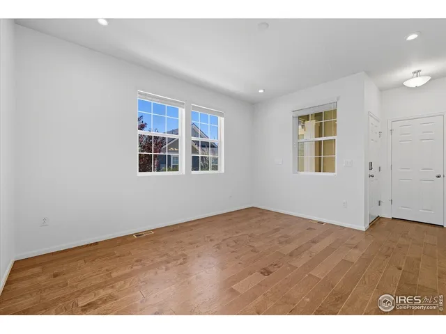 a bathroom with a sink mirror and toilet