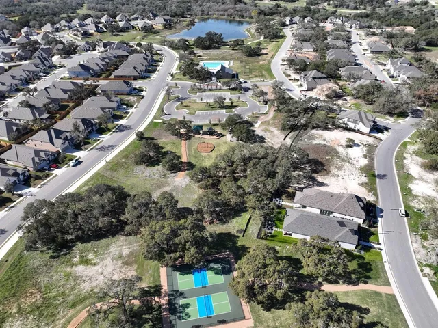 an aerial view of a house with outdoor space