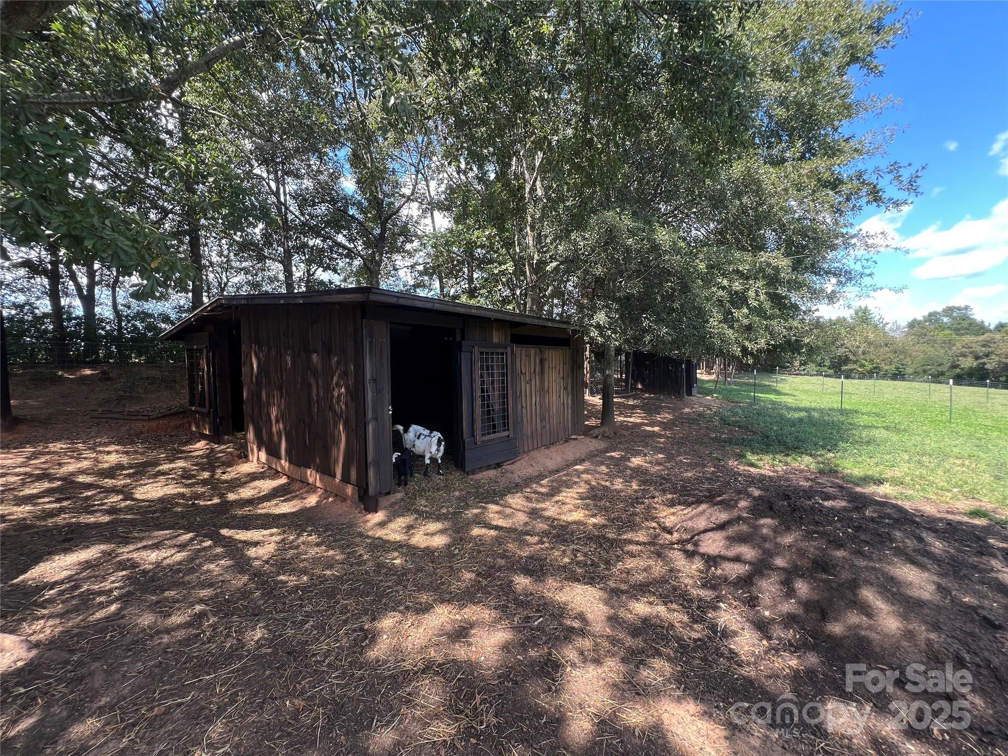 1301 Double Springs Church Road Shelby, NC 28150 - Photo 14 of 42 a view of a barn in the middle of a yard