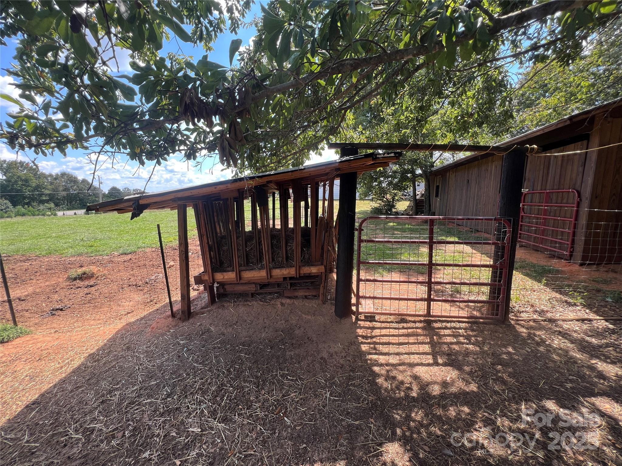 1301 Double Springs Church Road Shelby, NC 28150 - Photo 18 of 42 a view of a bench in a backyard