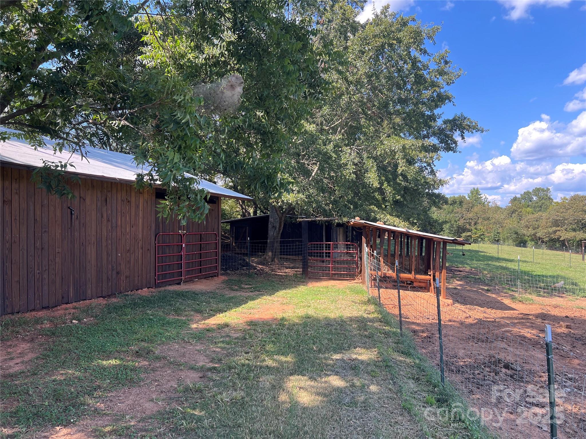 1301 Double Springs Church Road Shelby, NC 28150 - Photo 38 of 42 a view of a backyard with a garden and deck