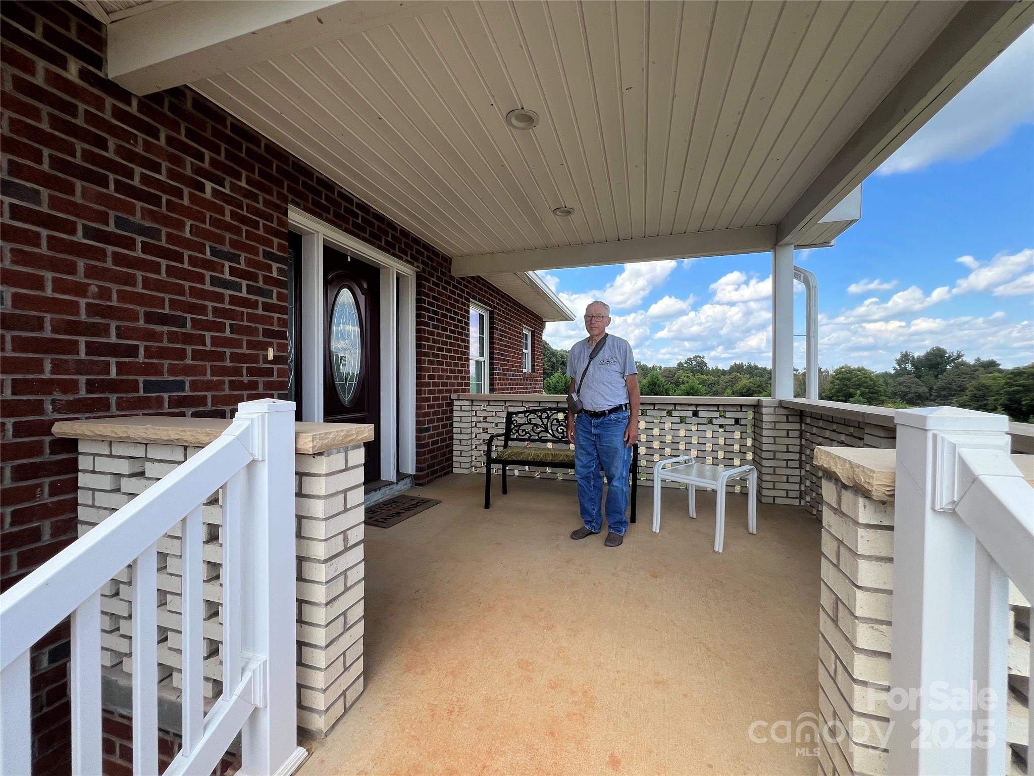 1301 Double Springs Church Road Shelby, NC 28150 - Photo 41 of 42 a roof deck with table and chairs and wooden fence