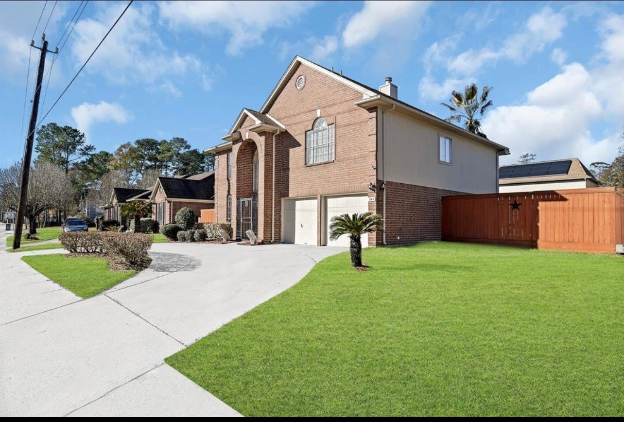 262 Normandy Street Houston, TX 77015 - Photo 2 of 12 a front view of a house with a yard and garage