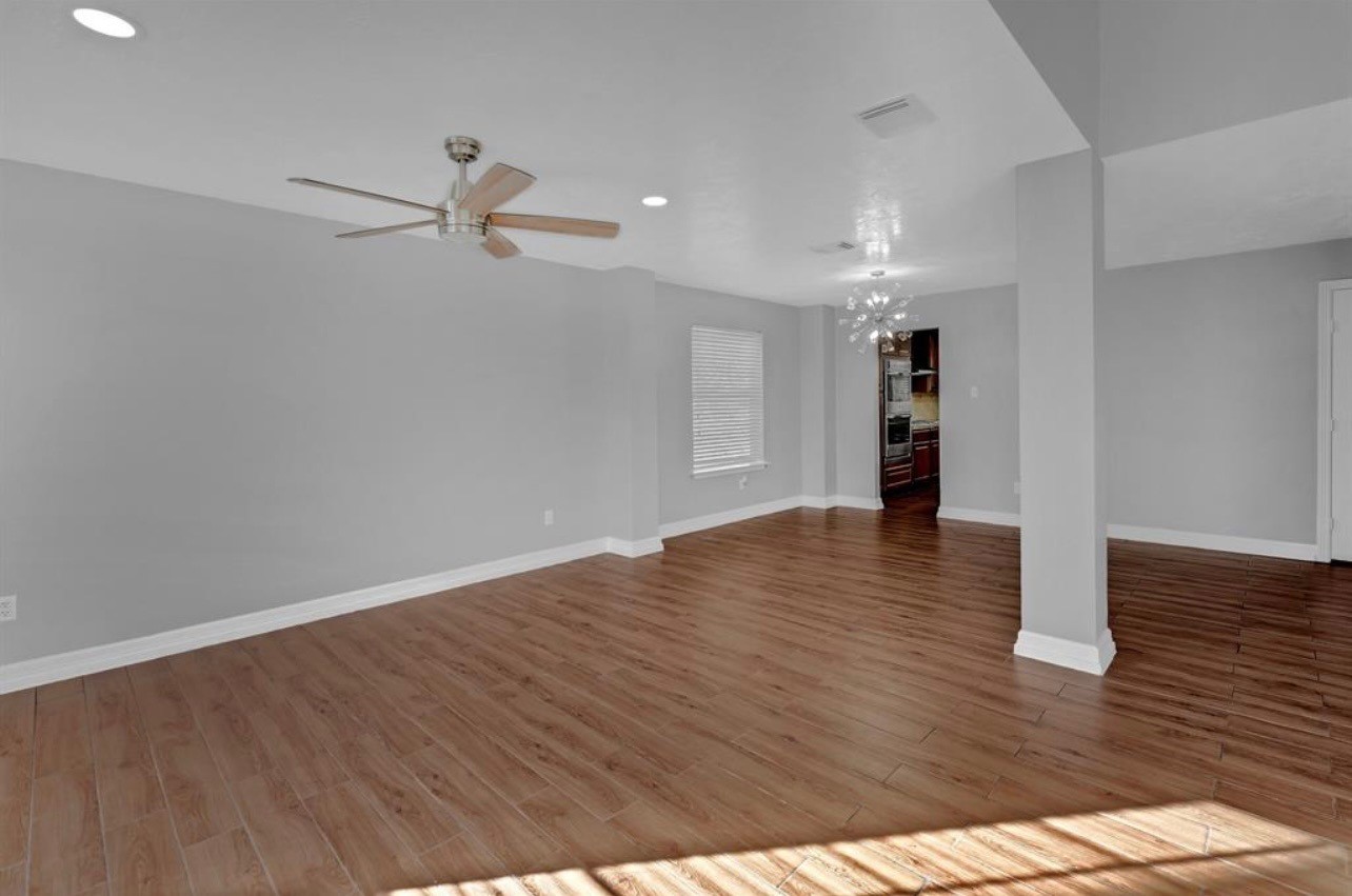 262 Normandy Street Houston, TX 77015 - Photo 6 of 12 a view of empty room with wooden floor