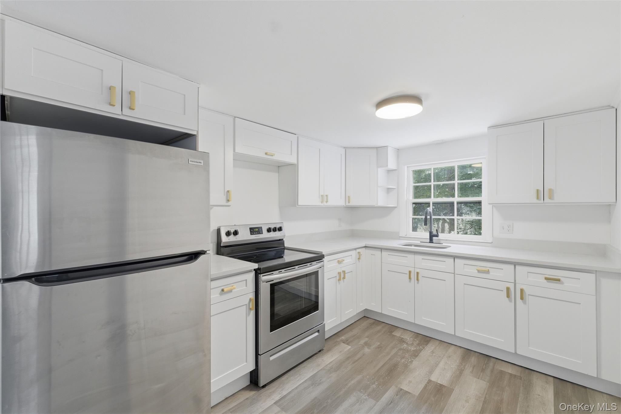 63 Parksville Road Pleasant Valley, NY 12569 - Photo 5 of 20 a kitchen with granite countertop white cabinets and white appliances