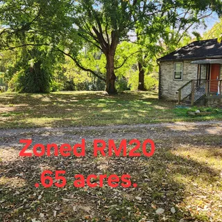 a front view of house with yard and flowers