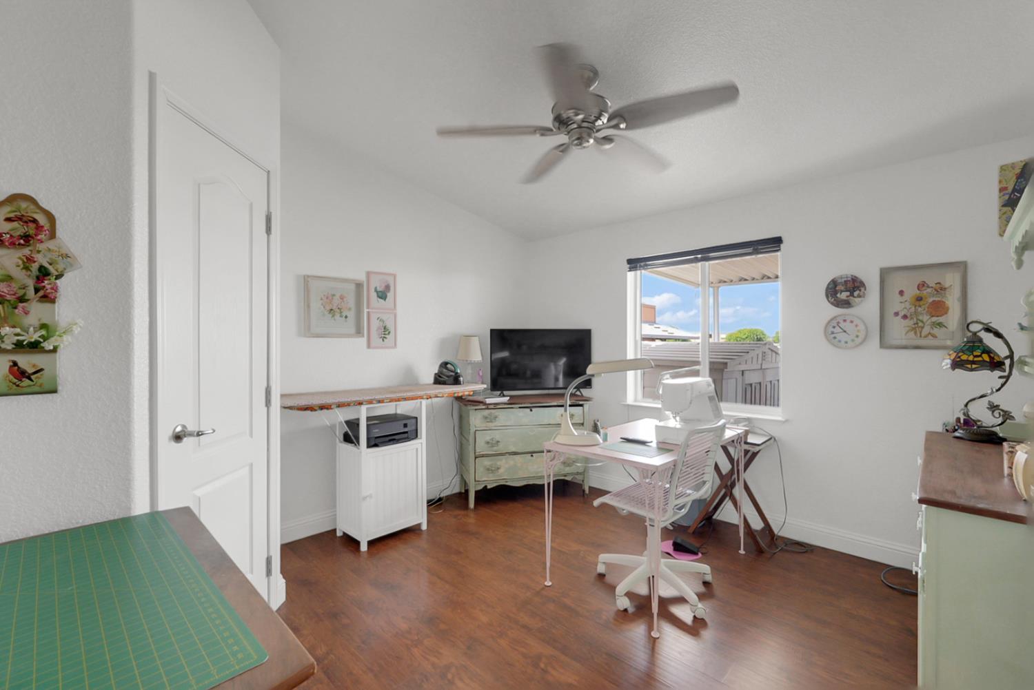 1459 Standiford, Unit 92 Modesto, CA 95350 - Photo 7 of 19 a view of a workspace with furniture and a flat screen tv