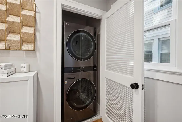 a view of a hallway with washer and dryer