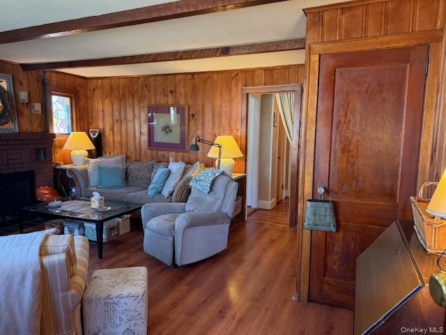 154 Cedar Road East Mastic Beach, NY 11951 - Photo 4 of 9 a living room with furniture and a fireplace